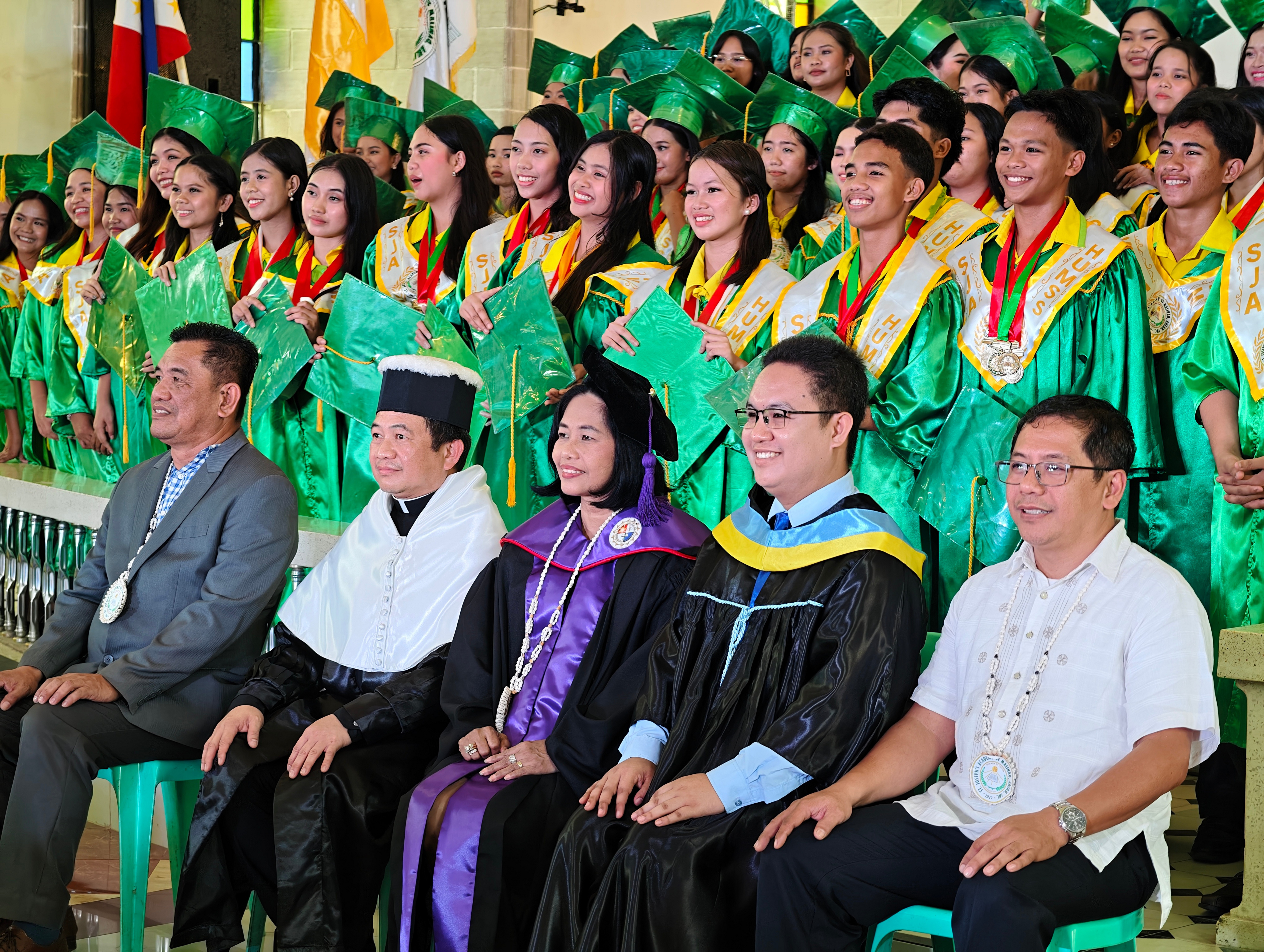 St. Joseph's Academy Guardians at their graduation with faculty and clergy